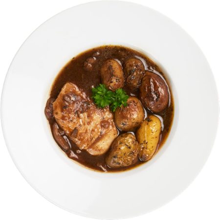 A plate of coq au vin